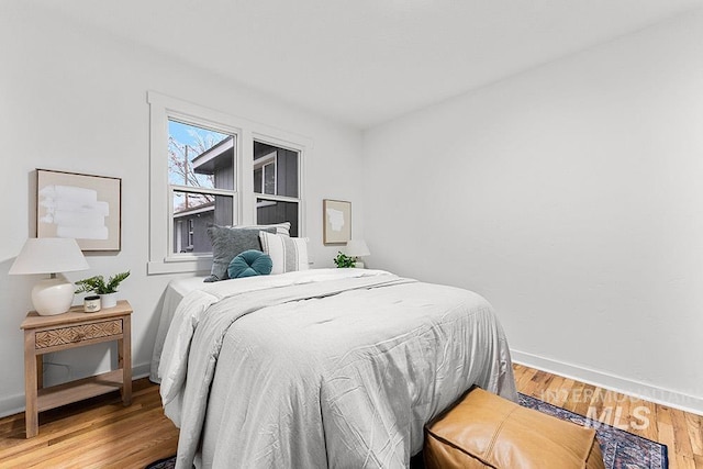 bedroom with wood-type flooring