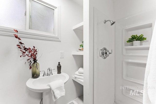 bathroom featuring walk in shower