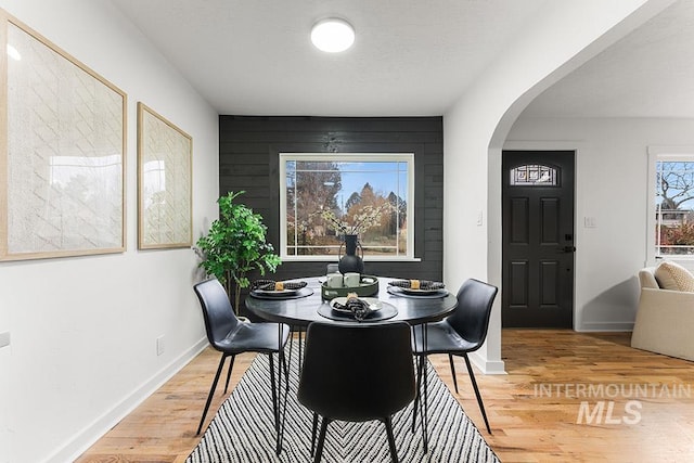 dining area with wood-type flooring