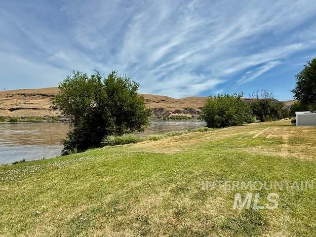407 1st St, Asotin, WA 99402 - view of green lawn featuring a water view