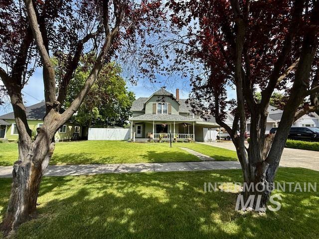 407 1st St, Asotin, WA 99402 - view of front of property featuring a porch and a chimney