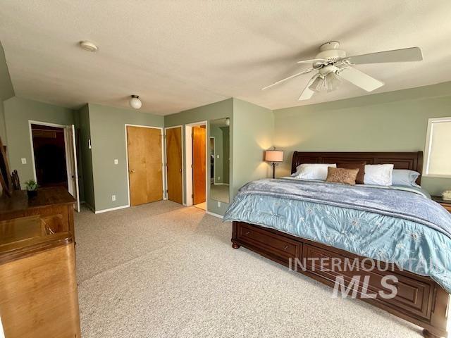 407 1st St, Asotin, WA 99402 - carpeted bedroom with baseboards and a ceiling fan