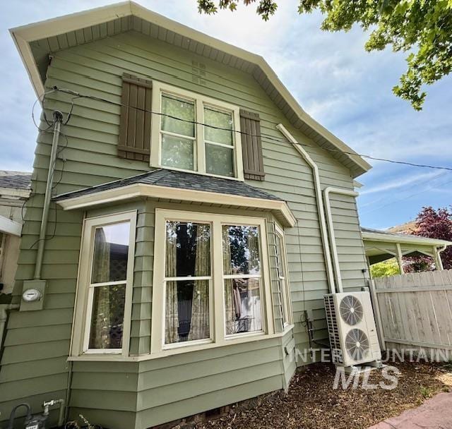 407 1st St, Asotin, WA 99402 - view of property exterior featuring an ac unit and roof with shingles