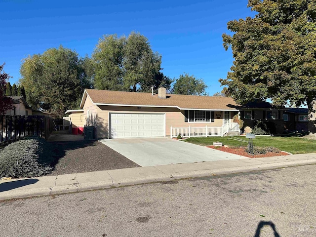 single story home with a front yard and a garage