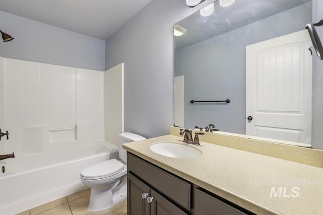 full bath with tile patterned flooring, toilet, vanity, and shower / bath combination