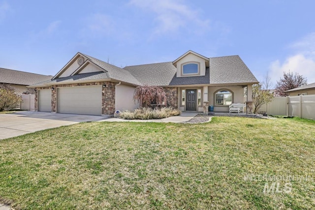 view of front of property featuring fence, concrete driveway, stucco siding, a front yard, and a garage