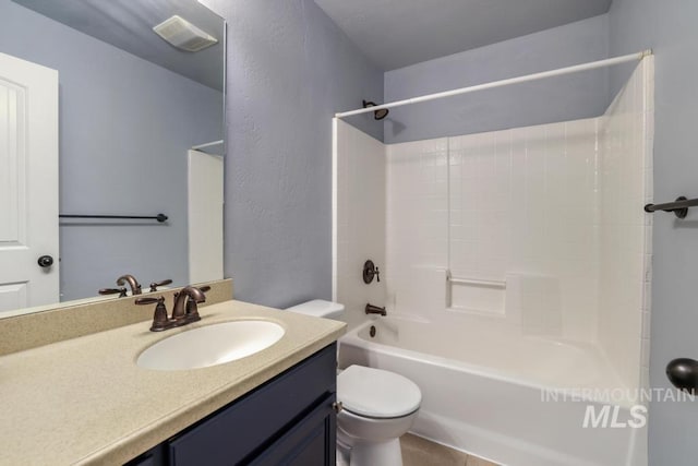 bathroom with vanity, a textured wall, toilet, shower / bathtub combination, and visible vents
