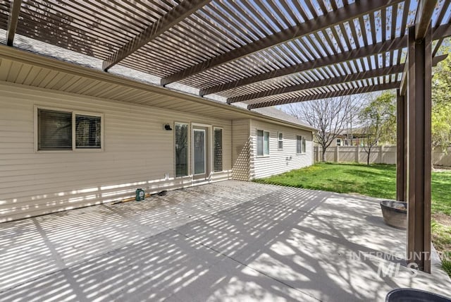 view of patio / terrace featuring fence and a pergola