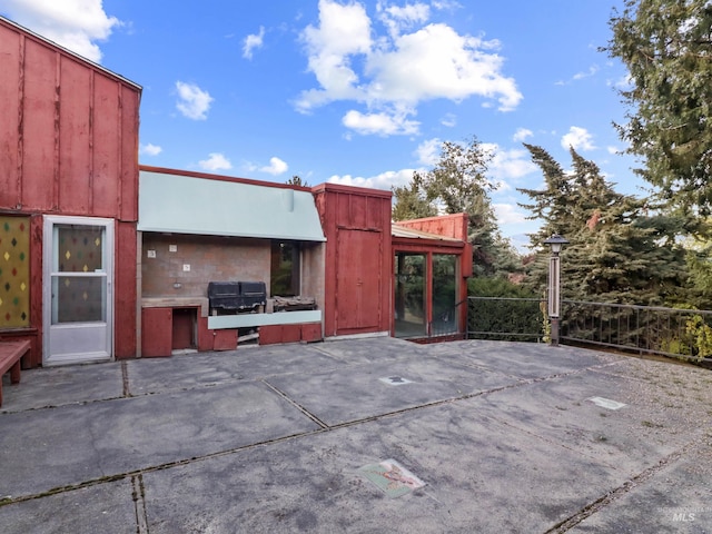 view of patio featuring a grill