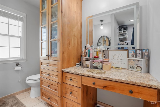 360 N 700 W, Paul, ID 83347 - bathroom with tile patterned floors, toilet, vanity, and baseboards