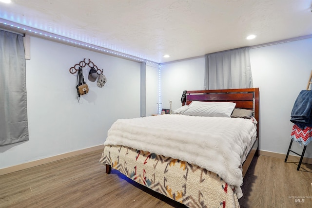 360 N 700 W, Paul, ID 83347 - bedroom featuring wood finished floors, baseboards, and recessed lighting