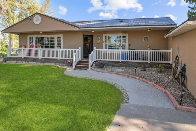 360 N 700 W, Paul, ID 83347 - ranch-style home with stucco siding, covered porch, and a front yard