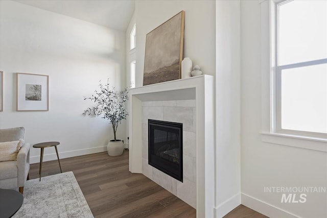 4265 W Thornapple Dr, Meridian, ID 83646 - living room featuring healthy amount of natural light, dark wood-style floors, baseboards, and a fireplace