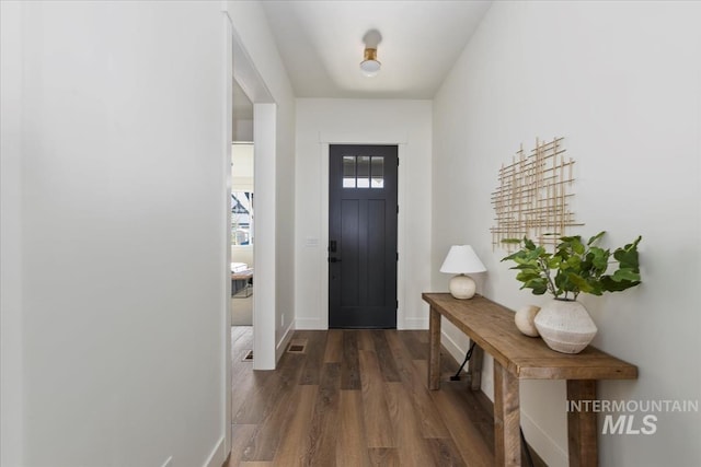 4265 W Thornapple Dr, Meridian, ID 83646 - foyer featuring dark wood finished floors and baseboards