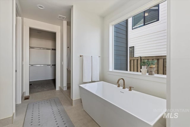 4265 W Thornapple Dr, Meridian, ID 83646 - full bath featuring a soaking tub, tile patterned floors, healthy amount of natural light, and baseboards