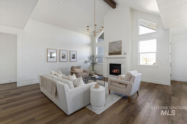 4265 W Thornapple Dr, Meridian, ID 83646 - living area with high vaulted ceiling, dark wood-style flooring, a fireplace, a chandelier, and beam ceiling