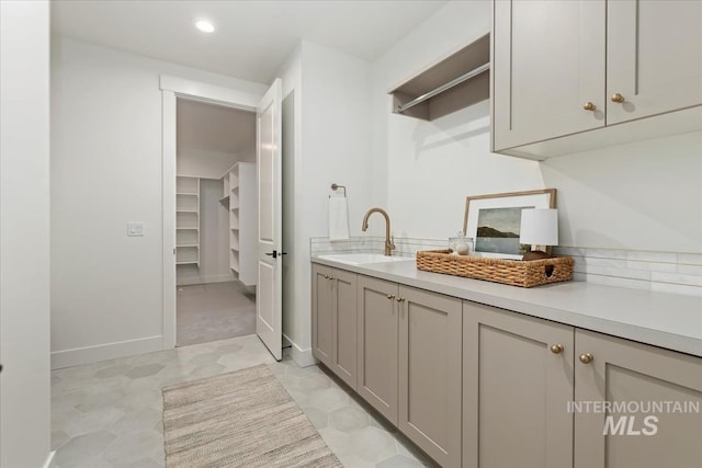 4265 W Thornapple Dr, Meridian, ID 83646 - laundry room featuring a sink, baseboards, and recessed lighting