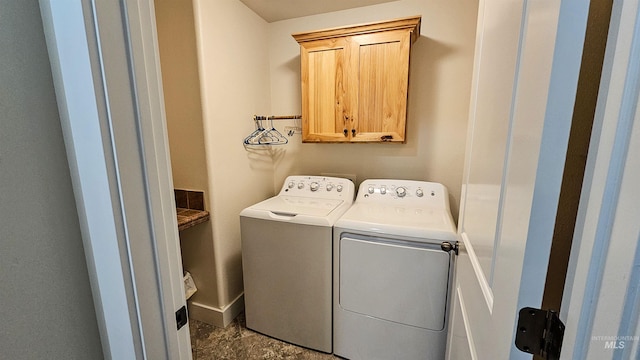 laundry area featuring cabinets and independent washer and dryer