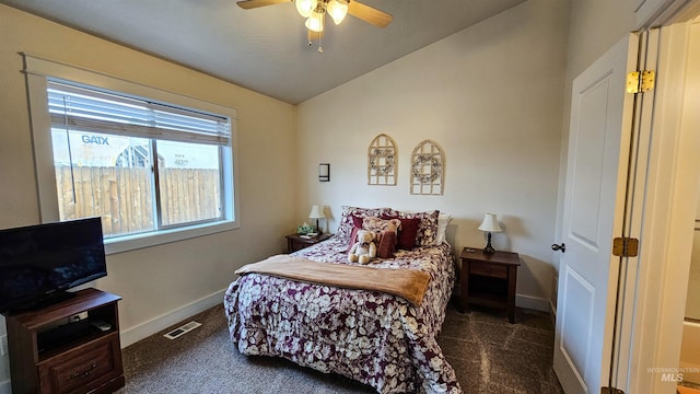 carpeted bedroom featuring vaulted ceiling and ceiling fan