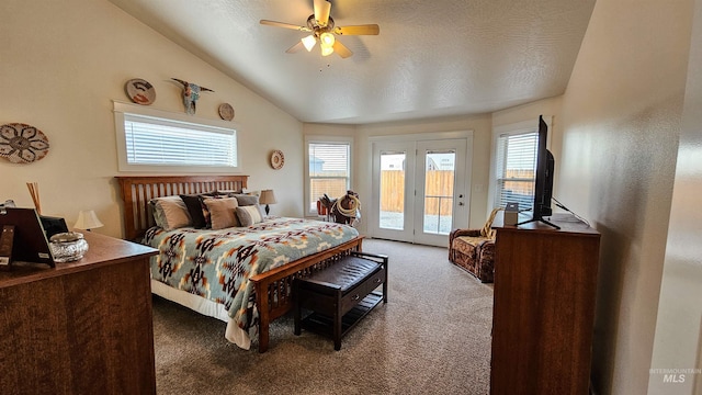 bedroom with ceiling fan, access to outside, french doors, vaulted ceiling, and carpet flooring