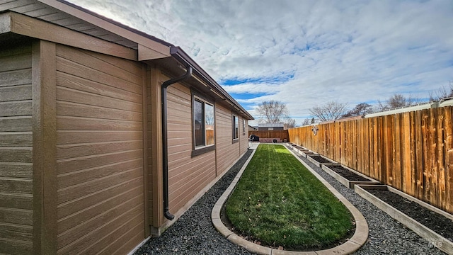 view of property exterior with a yard