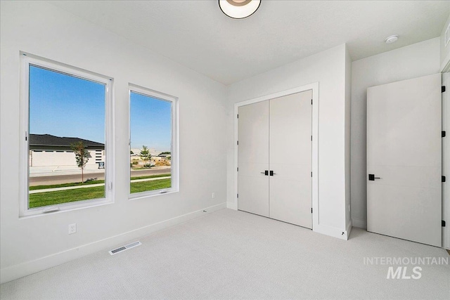 unfurnished bedroom with a closet