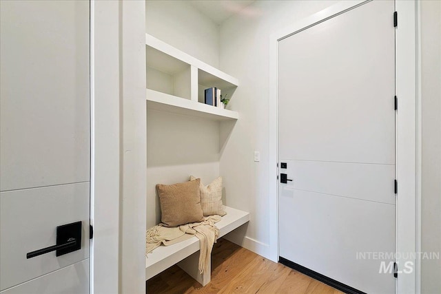 mudroom with light hardwood / wood-style flooring