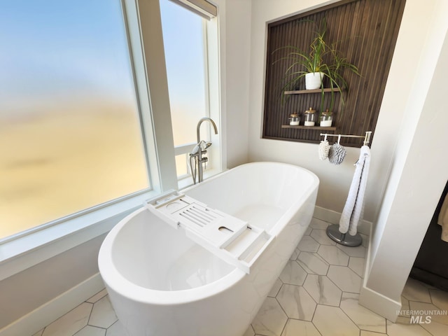 7063 S Pear Blossom, Meridian, ID 83642 - bathroom featuring tile patterned floors, baseboards, and a soaking tub
