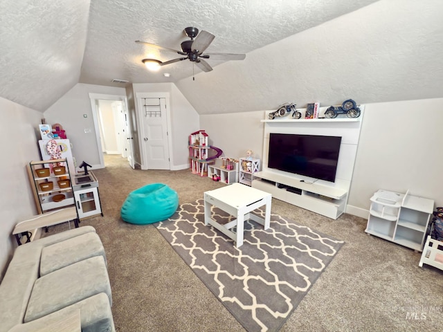 7063 S Pear Blossom, Meridian, ID 83642 - recreation room with a textured ceiling, a ceiling fan, visible vents, vaulted ceiling, and carpet flooring