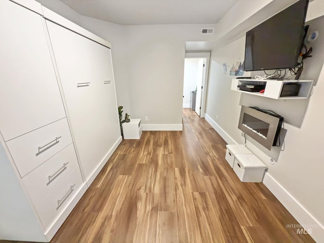 7063 S Pear Blossom, Meridian, ID 83642 - hall with light wood finished floors, visible vents, and baseboards