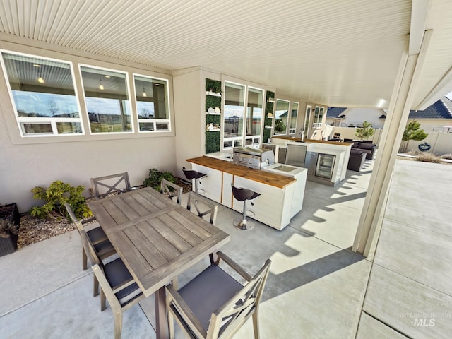 7063 S Pear Blossom, Meridian, ID 83642 - view of patio / terrace with outdoor wet bar, outdoor dining area, and exterior kitchen
