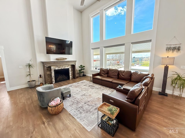 7063 S Pear Blossom, Meridian, ID 83642 - living area featuring a towering ceiling, baseboards, and wood finished floors