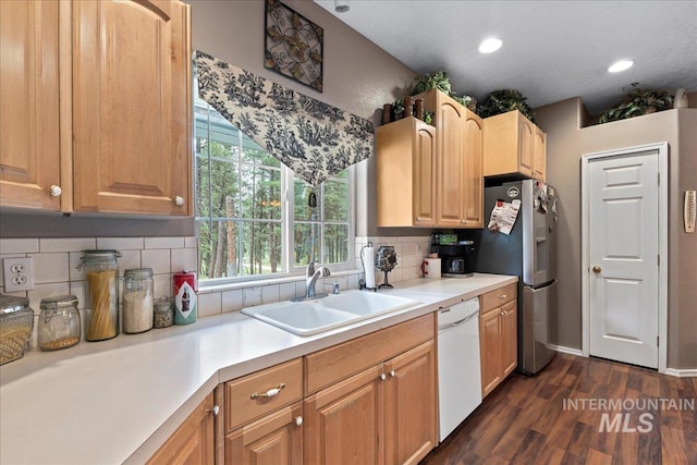 42 Hiatt Cir, Idaho City, ID 83631 - kitchen featuring dishwasher, stainless steel fridge, a sink, dark wood finished floors, and light countertops