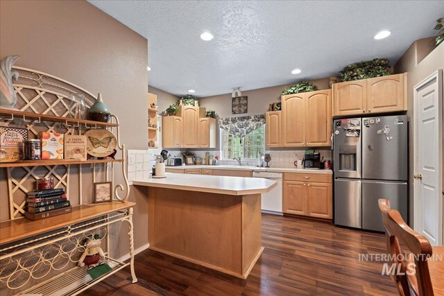 42 Hiatt Cir, Idaho City, ID 83631 - kitchen with stainless steel fridge with ice dispenser, dishwasher, light brown cabinetry, backsplash, and recessed lighting