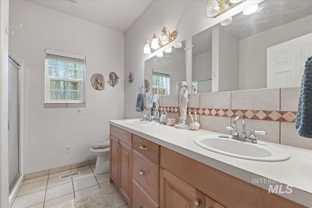 42 Hiatt Cir, Idaho City, ID 83631 - full bathroom featuring double vanity, tile patterned flooring, toilet, and a stall shower