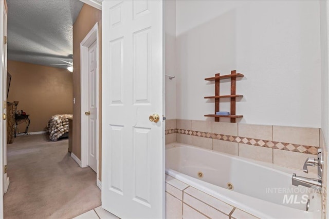 42 Hiatt Cir, Idaho City, ID 83631 - bathroom featuring a whirlpool tub, baseboards, and a textured ceiling