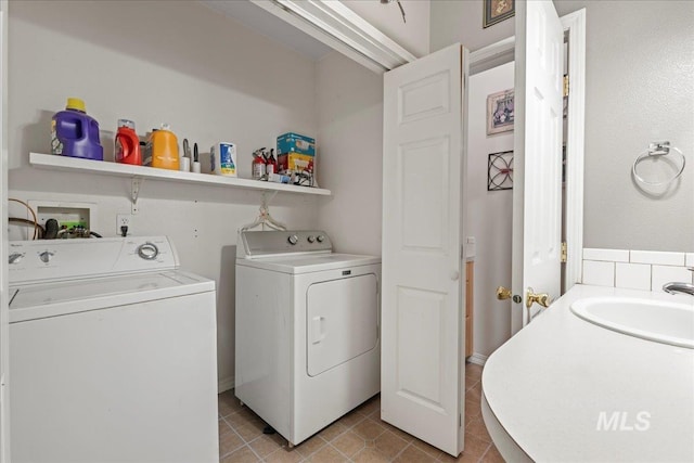 42 Hiatt Cir, Idaho City, ID 83631 - washroom with washer and dryer and light tile patterned floors