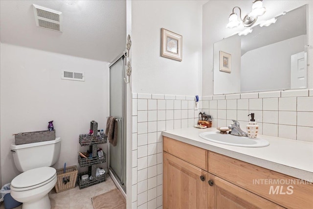42 Hiatt Cir, Idaho City, ID 83631 - full bath with a shower stall, toilet, vanity, and tile patterned flooring