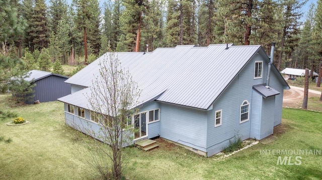 42 Hiatt Cir, Idaho City, ID 83631 - back of house with a yard and metal roof