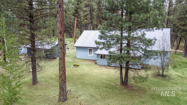 42 Hiatt Cir, Idaho City, ID 83631 - view of side of property featuring a yard and metal roof
