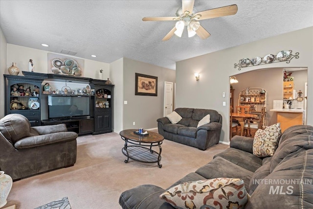42 Hiatt Cir, Idaho City, ID 83631 - living room featuring carpet flooring, a textured ceiling, ceiling fan, and baseboards