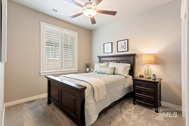bedroom featuring carpet floors, baseboards, a ceiling fan, and visible vents