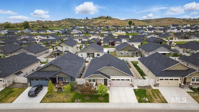birds eye view of property with a residential view and a mountain view