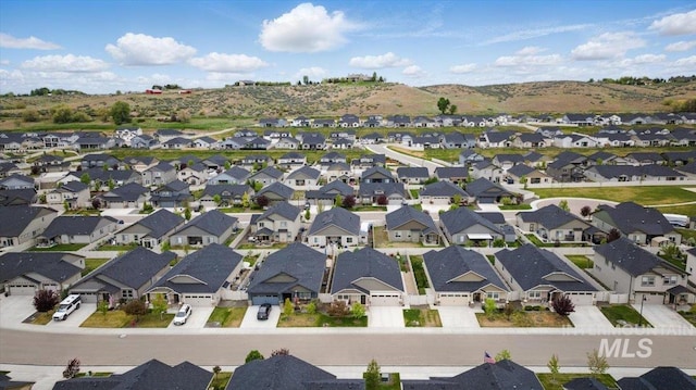 birds eye view of property with a residential view and a mountain view