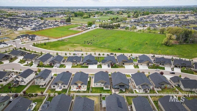 birds eye view of property with a residential view