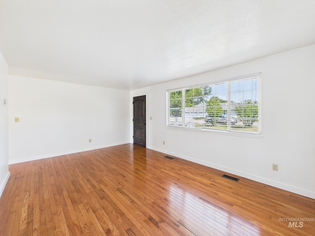1673 Thomas, Emmett, ID 83617 - unfurnished room featuring hardwood / wood-style floors and baseboards