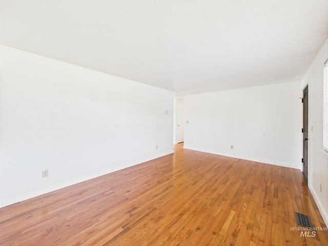 1673 Thomas, Emmett, ID 83617 - unfurnished room with light wood-style flooring and baseboards