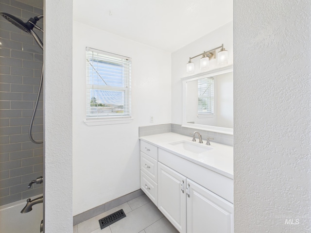 1673 Thomas, Emmett, ID 83617 - bathroom featuring vanity, plenty of natural light, tile patterned floors, and shower / washtub combination
