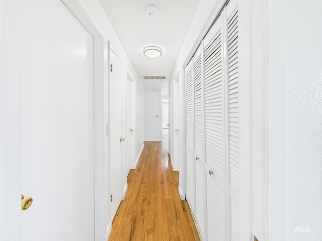1673 Thomas, Emmett, ID 83617 - corridor with light wood-type flooring and baseboards