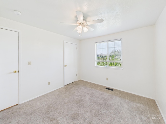 1673 Thomas, Emmett, ID 83617 - carpeted empty room with ceiling fan and baseboards